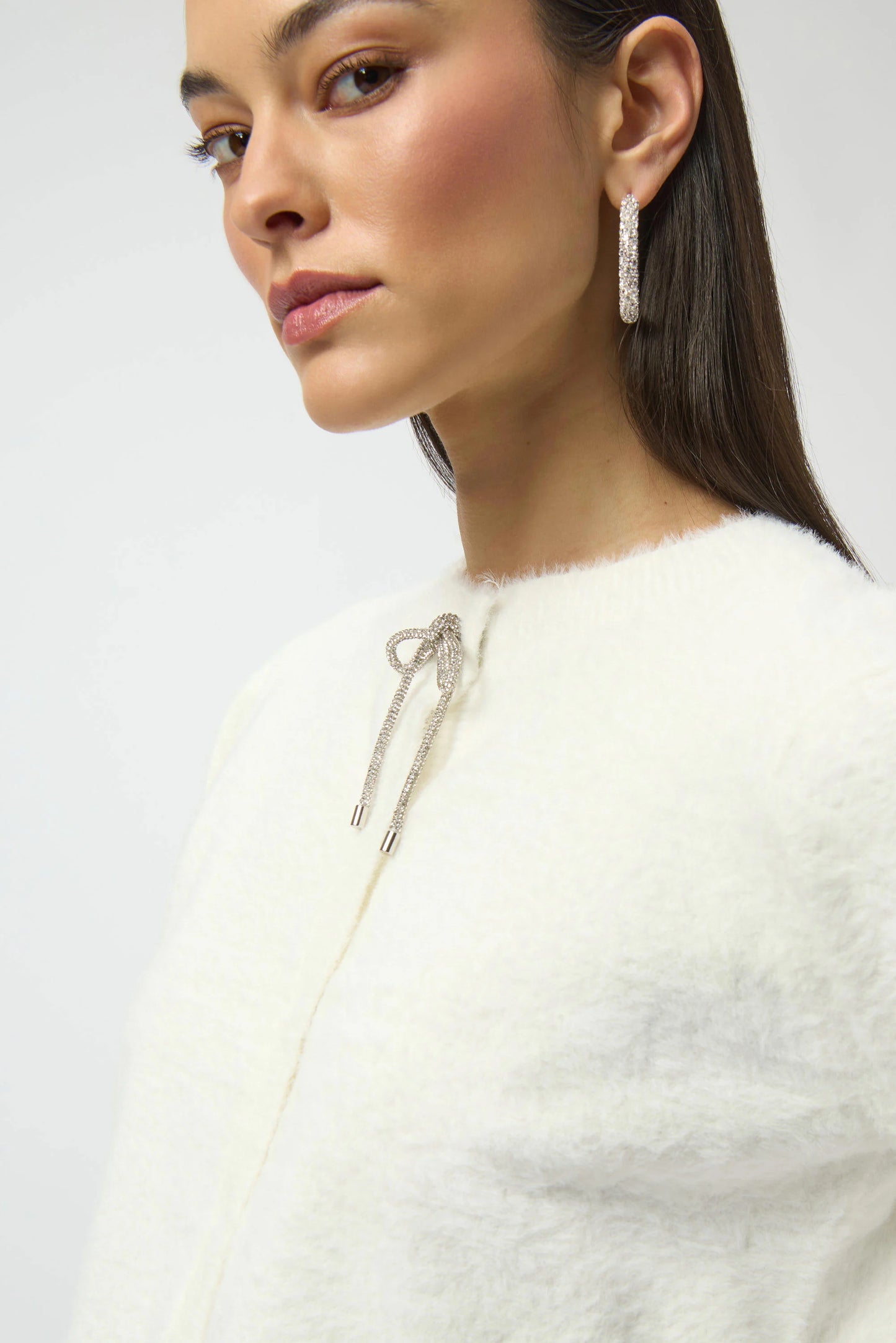 FEATHER YARN CARDIGAN W/ RHINESTONE BOW